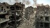 Clădiri distruse de loviturile aeriene israeliene în tabăra de refugiați palestinieni Jabalia din orașul Gaza, 11 octombrie 2023. Israelul a declarat război grupării Hamas la 8 octombrie, în urma unui atac șocant pe uscat, în aer și pe mare al islamiștilor din Gaza.