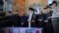 Iran's Supreme Leader Ayatollah Ali Khamenei (center) prays over the casket of Mohsen Hojaji, who was beheaded in Syria by Islamic State (IS) militants, in Tehran on September 27.