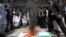 Lawyers burn a banner with a picture of India's national flag and Prime Minister Narendra Modi during an anti-India protest in Multan, Pakistan, on April 28.