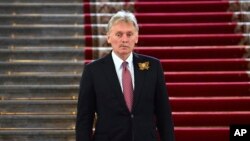 Russia - Kremlin spokesman Dmitry Peskov walks down stairs during the celebrations to mark the 79th anniversary of Soviet victory over Nazi Germany, Moscow, May 9, 2024.