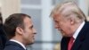 French President Emmanuel Macron (left) greets U.S. President Donald Trump (right) upon his arrival in Paris on November 10.