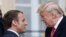 French President Emmanuel Macron (left) greets U.S. President Donald Trump (right) upon his arrival in Paris on November 10.