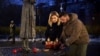 Ukrainian President Volodymyr Zelenskiy and his wife, Olena Zelenska, attend a memorial to the victims of the Holodomor famine of 1932-1933, in Kyiv on November 26.