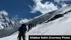 The HikeVentures team cuts a path during a winter climbing expedition. 