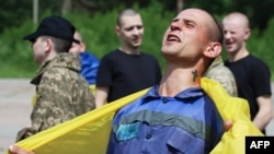 A Ukrainian prisoner of war (POW) celebrates following an exchange with Russia at an undisclosed location on June 9, 2025.