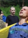 A Ukrainian prisoner of war (POW) celebrates following an exchange with Russia at an undisclosed location on June 9, 2025.