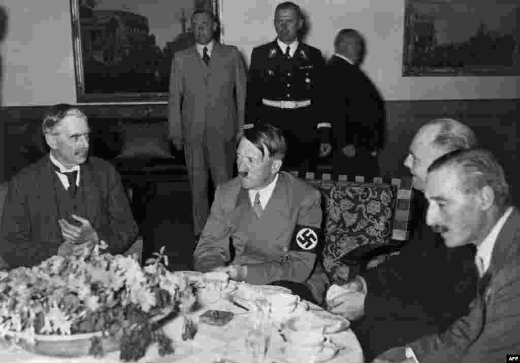 Neville Chamberlain and Adolf Hitler meet for the "talk over the teacups" at Berchtesgaden, Germany, on September 24, 1938. Hitler demanded that Czechoslovakia cede the Sudetenland by September 28. Following a political crisis in May, Hitler had told his generals that an invasion should begin no later than October 1.