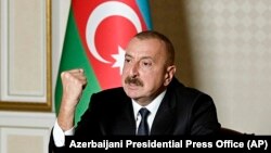 AZERBAIJAN -- Azerbaijani President Ilham Aliyev gestures as he addresses the nation in Baku, October 20, 2020