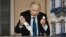 FRANCE – People walk past a painting depicting Russian President Vladimir Putin killing a dove, at Place de la Paix in Lyon, central eastern France, in March 22, 2022