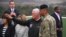 U.S. Vice President Mike Pence (center) talks with U.S. General Vincent K. Brooks (right), commander of the United Nations Command, Combined Forces Command, and United States Forces Korea, as they visit Observation Post Ouellette near the truce village of Panmunjom.