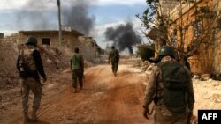 Syrian government forces patrol the outskirts of embattled Syrian city of Aleppo earlier this week.