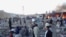 People gather after a bomb targeting Shi'ite Muslims exploded in busy market in Hazara town, an area dominated by Shi'a on the outskirts of Quetta in southwestern Pakistan.