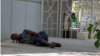 Turkmenistan. Drunk man sleeping on the ground. Ashgabat. July 2021