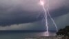 RUSSIA -- A lightning bolt is seen over the Black Sea off the resort village of Dagomys, Lazarevsky District, Sochi, Spetember 21, 2021