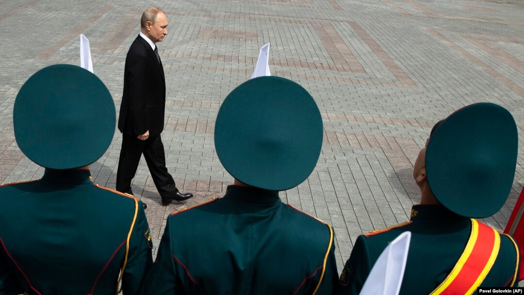 Russian President Vladimir Putin attends a wreath-laying ceremony at the Tomb of the Unknown Soldier after the military parade marking the victory in World War II in Moscow on May 9, 2019.