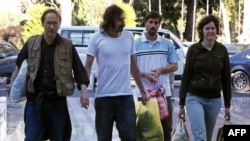 James Foley (second from right) walks with other journalists freed in May 2011 in the Libyan capital, Tripoli, after being abducted while covering the Libyan conflict.