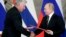 Russian President Vladimir Putin (right) and Cuban President Miguel Diaz-Canel exchange documents following their meeting at the Kremlin in Moscow on November 2. 