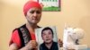 KAZAKHSTAN-CHINA-RIGHTS-XINJIANG-COURT Bikamal Kaken poses with a portrait of her disappeared husband Adilgazy Muqai in a rental apartment in the provincial town of Uzynagash, around 60 kilometres from Kazakhstans largest city Almaty, on August 27, 2020.