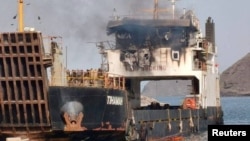 Smoke rises from the damaged cargo vessel Tihamah near Murad, Yemen, on August 11.