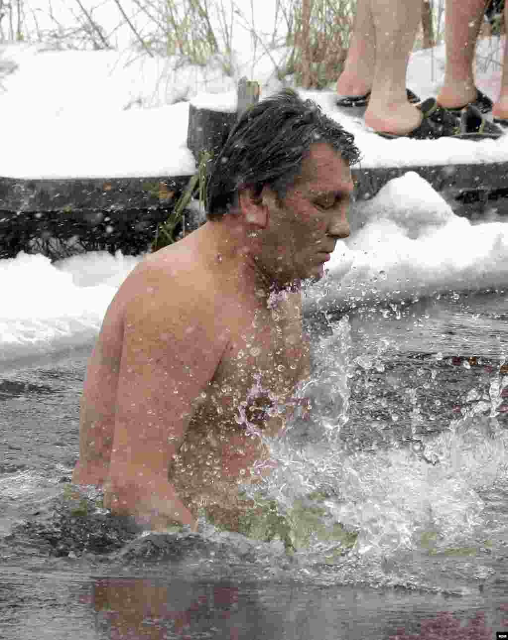 Ukrainian President Viktor Yushchenko takes a dip in the ice-cold waters of the Dnieper River in January (epa) - Oil and gas are forms of 'soft power,' but it felt hard and harsh to Ukrainians when, in the middle of winter, Russia turned the gas taps off. Georgians too found themselves freezing, and few there believed the January explosions that cut the pipeline from Russia were accidental. The suspicions persisted and across Europe politicians voiced fears that Russia is using its energy power too energetically.