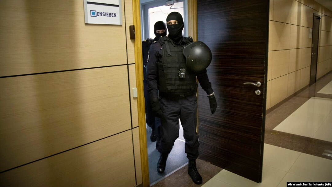 Police raid the offices of Aleksei Navalny's Anti-Corruption Foundation in Moscow last year. The graft watchdog is just one of many NGOs targeted by Russian authorities in the run-up to this year's parliamentary elections. 