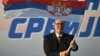 Predsjednik Srbije Aleksandar Vučić maše srpskom zastavom tokom mitinga u Beogradu 27. juna 2026. godine