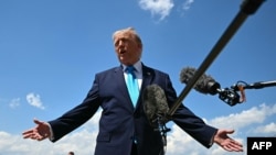 US President Donald Trump speaks to reporters as he returned to Washington DC on May 20.
