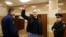 Opposition leader Sergei Udaltsov gestures as he arrives at the Moscow City Court building on February 18.