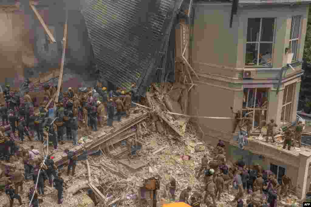 Emergency and rescue personnel clear the rubble of a destroyed building on the campus of the Okhmatdyt&nbsp;children&#39;s hospital following a Russian missile attack in the Ukrainian capital on July 8.