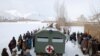 Afghanistan - People of Badgah village gather to receive medical treatment from Chaghcharan PRT medics. Ghor, 17Jan2008