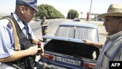 Police check cars for weapons on the road to Ekazhevo in Ingushetia. Militants in the region had announced a moratorium on attacking such rank-and-file members of the police.