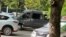 A van with Belarusian security officers pictured outside RFE/RL's offices in Minsk on July 16. 