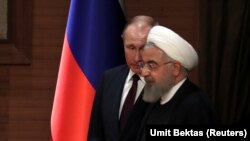 Президент Ирана Хасан Роухани (на переднем плане) и президент России Владимир Путин.