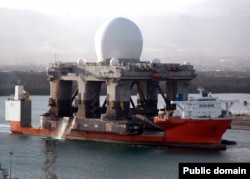 America’s Sea-Based X-Band Radar, designed to track incoming ICBMs, being transported by ship into Pearl Harbor, Hawaii, in 2006