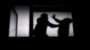 GENERIC -- Silhouette of couple arguing, man beating helpless woman, domestic violence concept, illustration