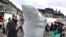 A WWF-sponsored artist carves an ice sculpture of a polar bear in Copenhagen to highlight the UN Climate Conference that is set to begin on December 7.