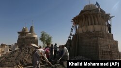 Un templu al comunității yazidi din Irak în reconstrucție după eliberarea teritoriului de sub Statul Islamic