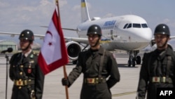 Turkish soldiers stand guard as a plane carrying Ukrainian President Volodymyr Zelenskyy arrives in Ankara ahead of a NATO summit on July 7.  