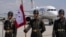 Turkish soldiers stand guard as a plane carrying Ukrainian President Volodymyr Zelenskyy arrives in Ankara ahead of a NATO summit on July 7.  