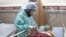 Coronavirus patient with nurse in Iran