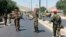 Afghan security forces arrive at the site of an explosion in Kabul on July 1.