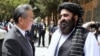Chinese Foreign Minister Wang Yi (left) and the Taliban government's acting foreign minister, Amir Khan Muttaqi, in Kabul in August 2025
