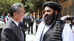 Chinese Foreign Minister Wang Yi (left) and the Taliban government's acting foreign minister, Amir Khan Muttaqi, in Kabul in August 2025
