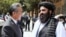 Chinese Foreign Minister Wang Yi (left) and the Taliban government's acting foreign minister, Amir Khan Muttaqi, in Kabul in August 2025
