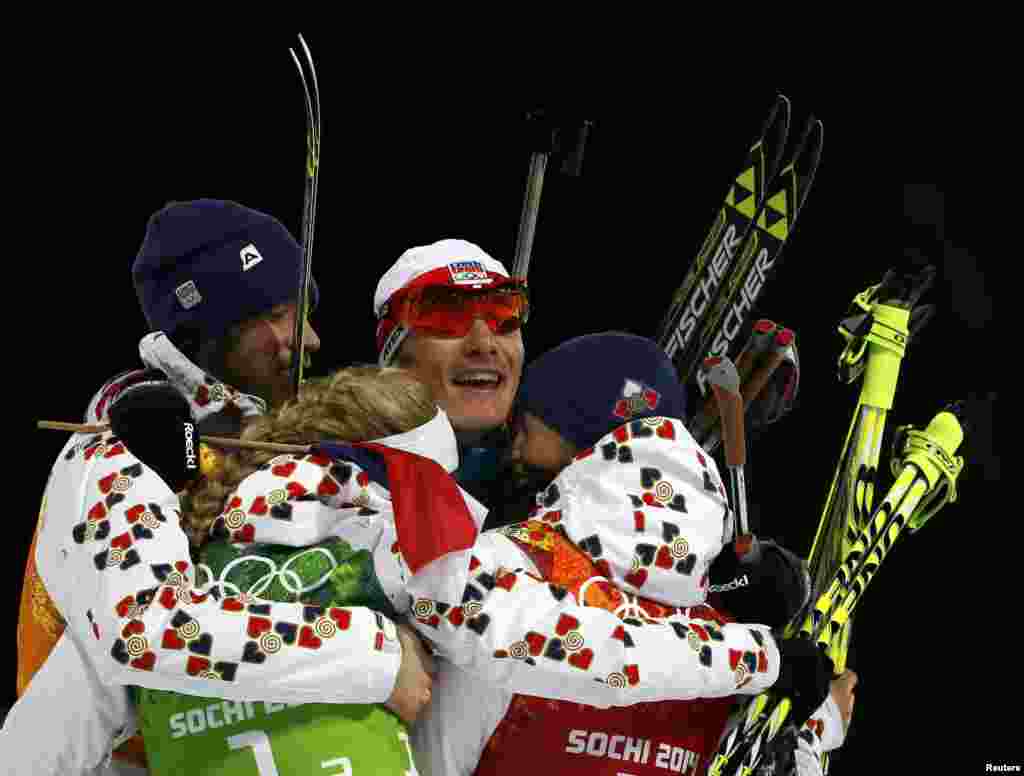 (Left to right:) Silver medal winners Jaroslav Soukup, Gabriela Soukalova, Ondrej Moravec, and Veronika Vitkova of Czech Republic celebrate after completing the mixed biathlon relay. (Reuters/Stefan Wermuth)