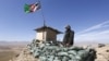 An Afghan National Army (ANA) soldier keeps watch at a check post in Logar province.