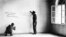 FILE - In this June 14, 1945 file photo a couple of American soldiers write their names on the wall of the bedroom where Adolf Hitler was born in Braunau, Austria.