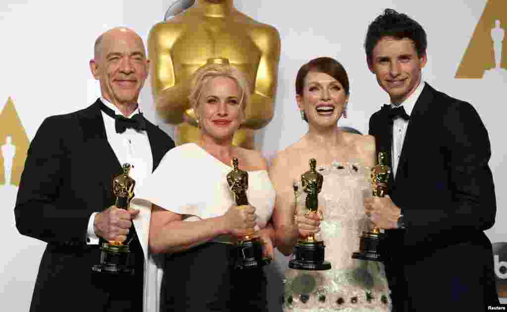 Winners pose for a group pic - from left to right: J.K. Simmons (Best Supporting Actor for Whiplash), Patricia Arquette (Best Supporting Actress for Boyhood), Julianne Moore and Eddie Redmayne.
