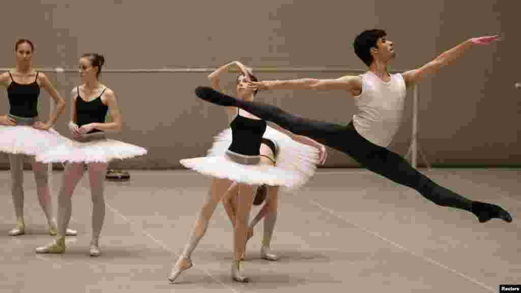 Mario Labrador (right) from California takes part in a lesson at the Bolshoi Ballet Academy in Moscow. (REUTERS/Denis Sinyakov)