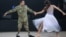 Ukrainian soldier Artem dances with partner Polina at the Brave Hearts charity ball in Kyiv on May 31. "On the one hand, it's very simple," the serviceman said, describing dancing as a double amputee, "on the other hand it's physically very difficult. You have to dream, set goals, move forward, and prove by example that nothing is impossible."<br><br>Photo by Serhiy Nuzhnenko/RFE/RL's Ukrainian Service.